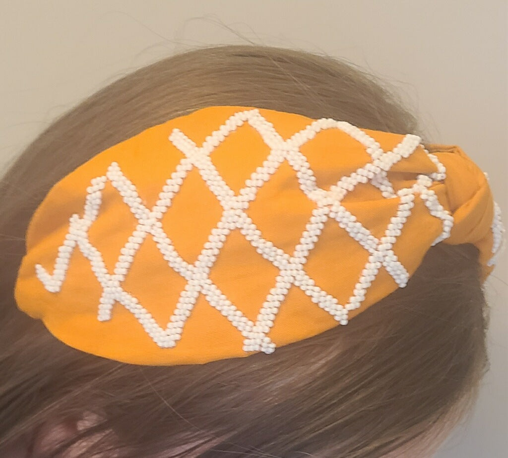 Diadema de rayas naranjas y blancas